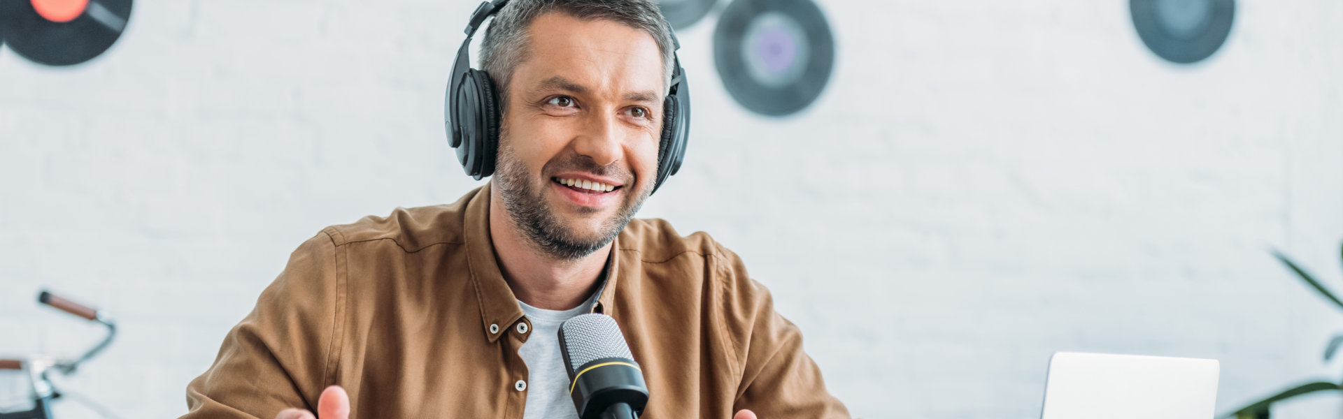 man smiling with headphones on